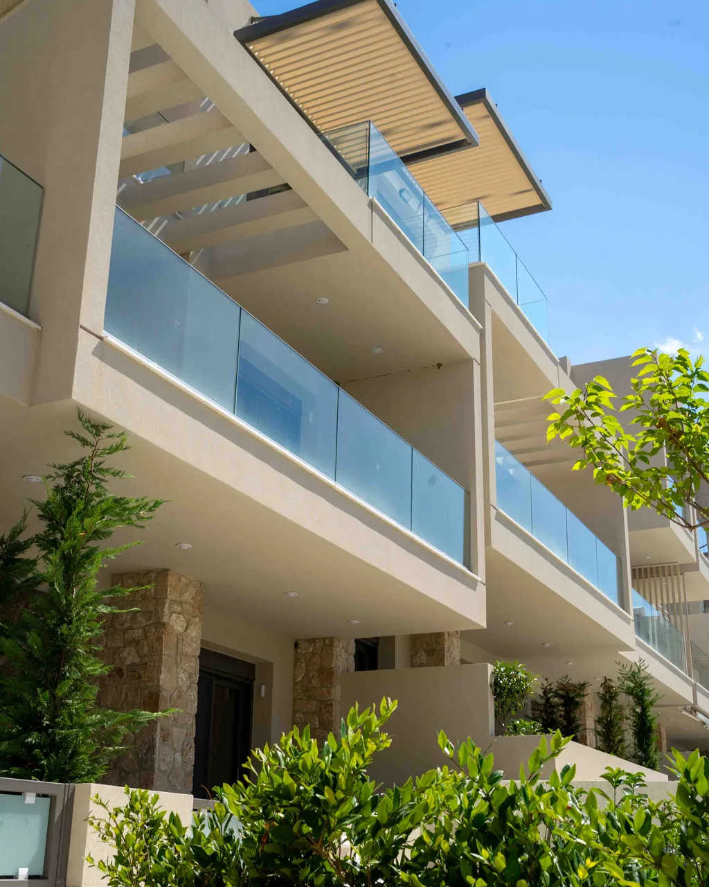 Facade of the Orphia holiday complex with balconies and glass balustrades