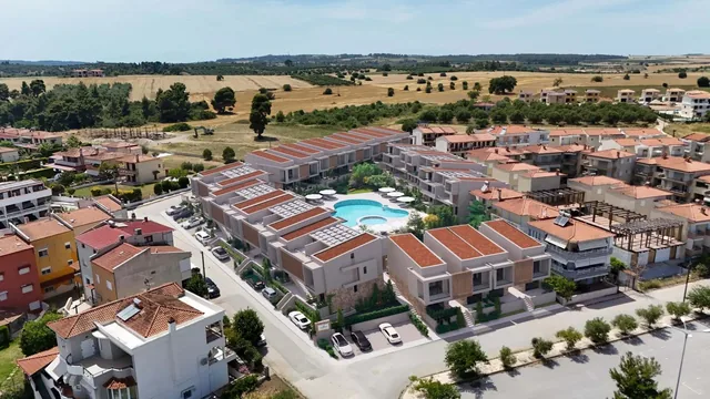 Aerial view of the rooftops and pool of the Orphia complex