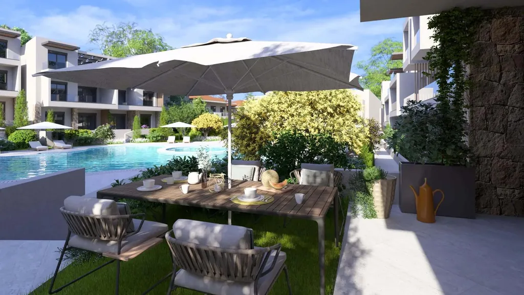 Shared pool of the Orphia complex with balconies and sun loungers