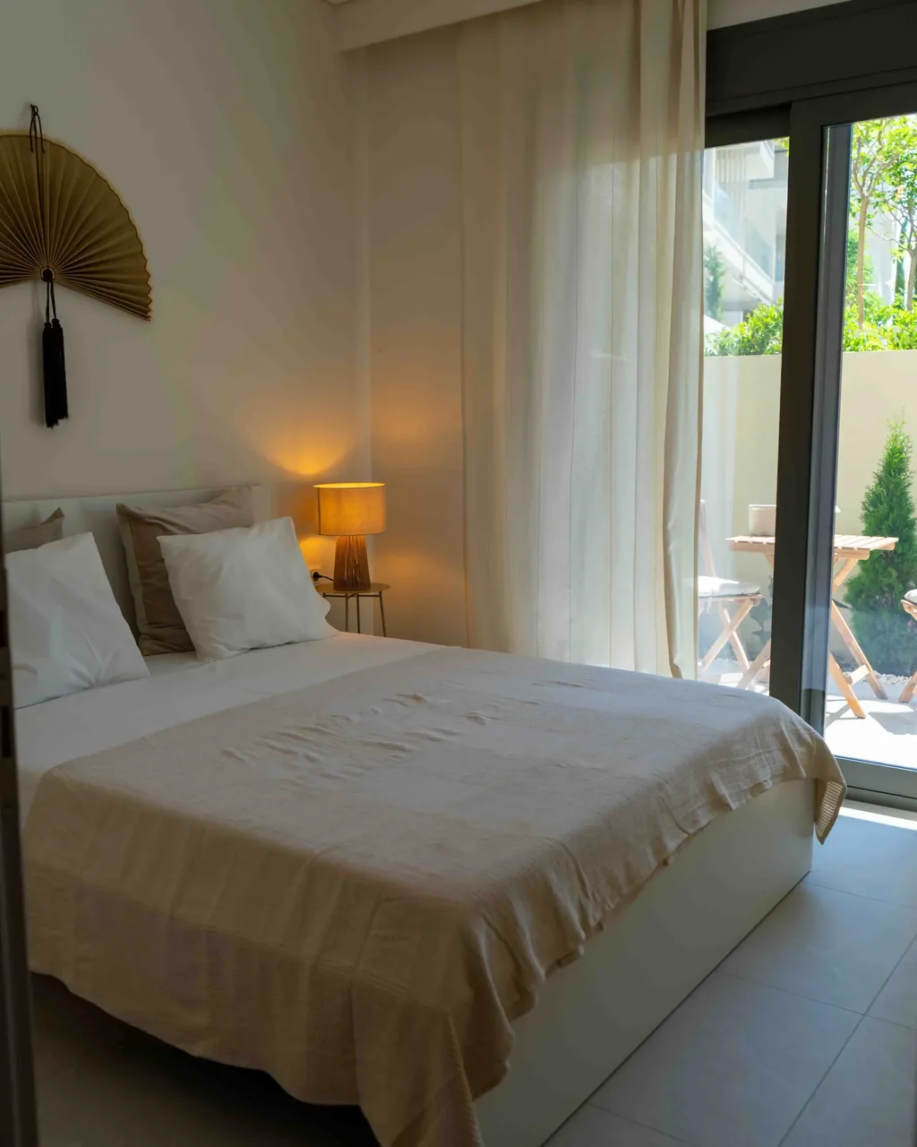 Bedroom with private balcony access in the Orphia apartment