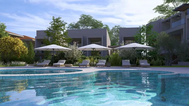 Sun loungers by the pool at the Orphia complex