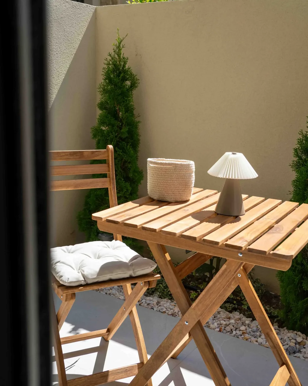 Terrace of the Orphia apartment in the evening with warm lighting