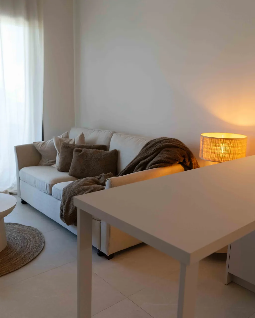 Living area with dining space and terrace access in the Orphia apartment